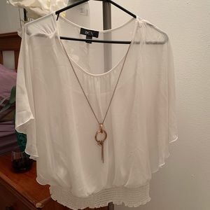 White shirt with attached necklace